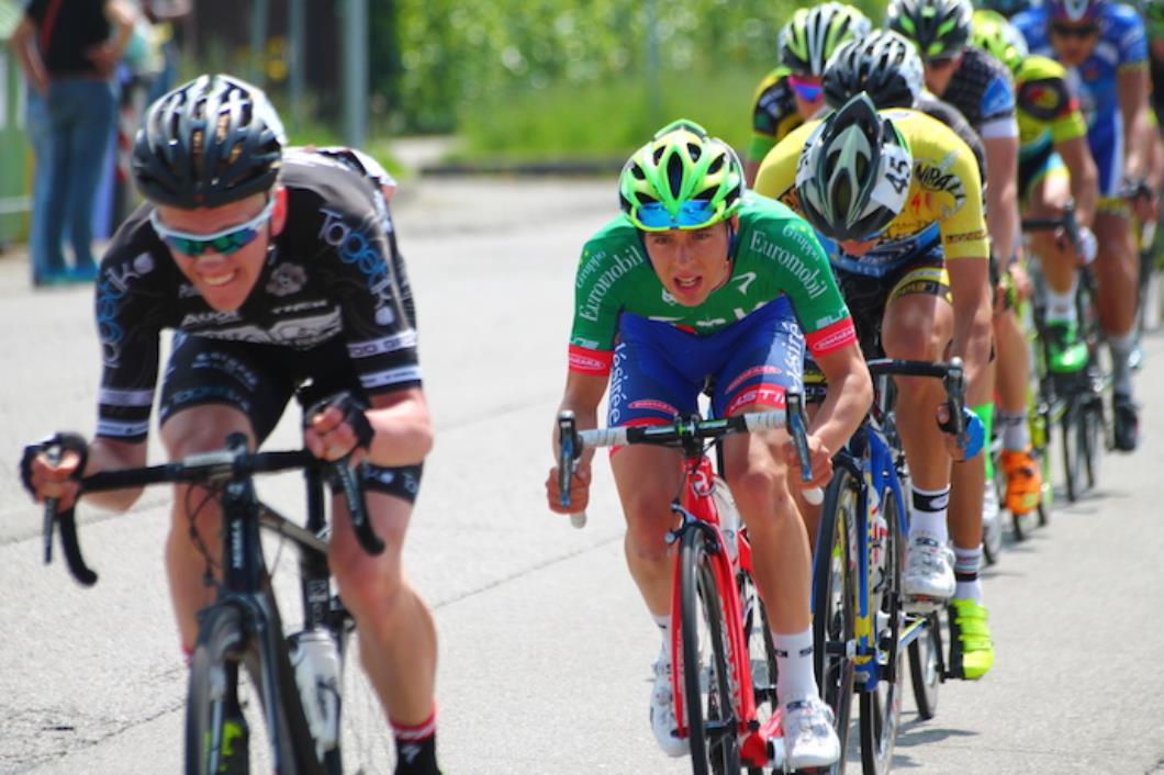 Racing cyclists, pace line, lead rider in black, following rider in green jersey with red and white stripes, Dan Pearson, Zalf, pic: Noemi Odessi